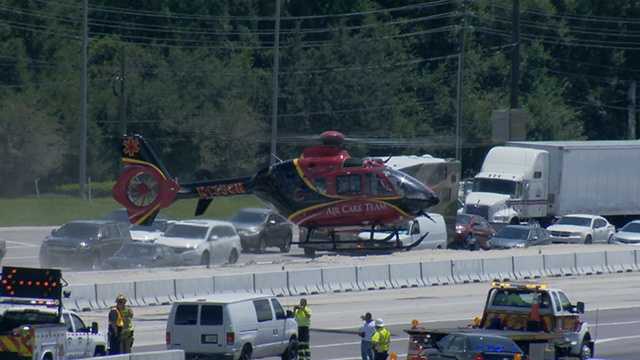 A helicopter flies a critically injured driver to Orlando Regional Medical Center.