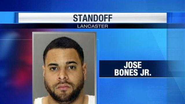 Man accused of pointing gun at woman, children