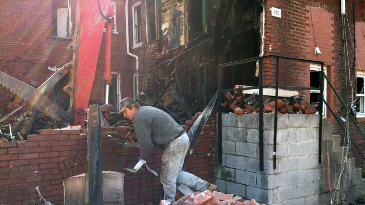 See crews prepare rowhomes for demolition
