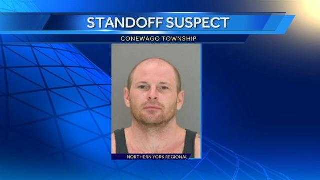 Police: Man barricades himself in home with child