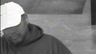 This a surveillance photo of a bank robbery suspect.