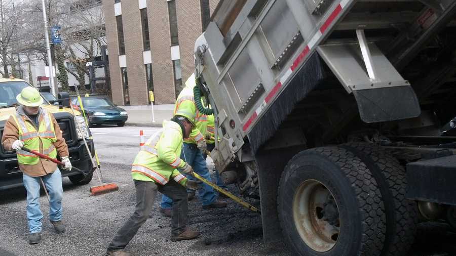 A pothole crew works on Front Street near Chestnut Street in Harrisburg.