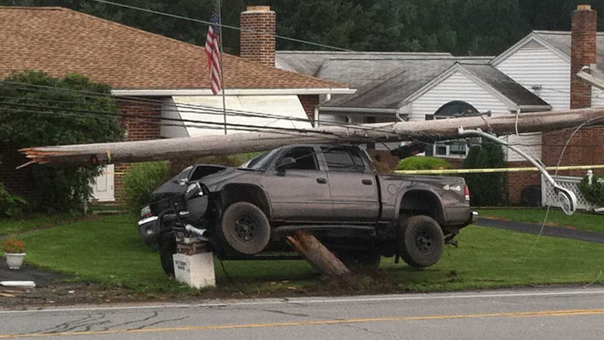 Photos: Truck crashes through pole