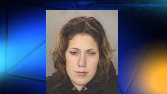 Police: Woman accused in parking lot robbery