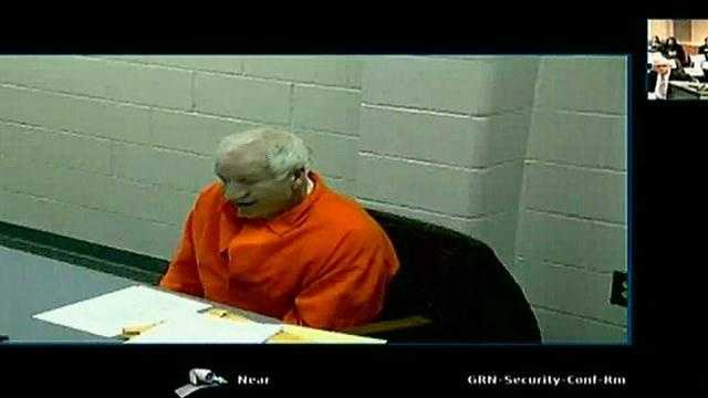 Jerry Sandusky, wearing an orange prison jumpsuit, testifies via video Tuesday morning.