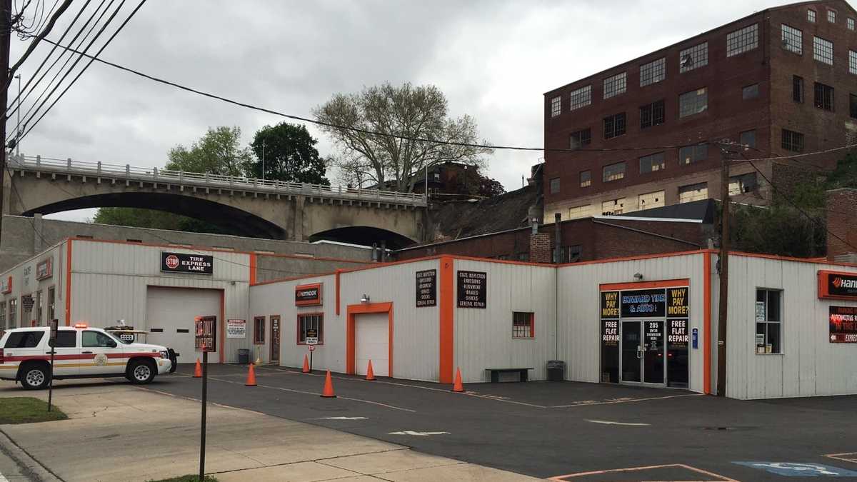 PHOTOS Car lands on tire store near Harrisburg bridge