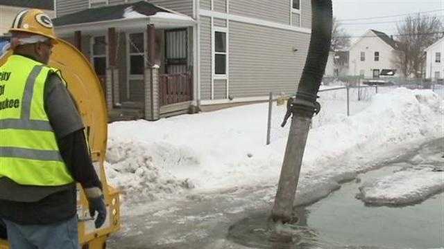 Crews work to clear flooded roads