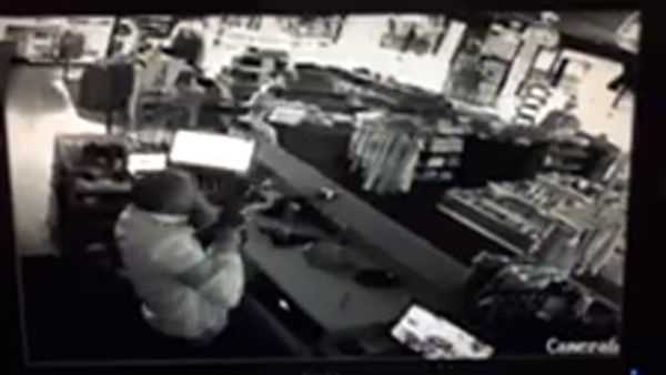 Surveillance video show a Milwaukee man defending his store against a brazen break-in by would-be burglars.