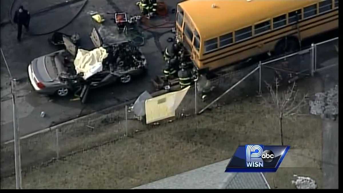 Driver dies after crash with school bus