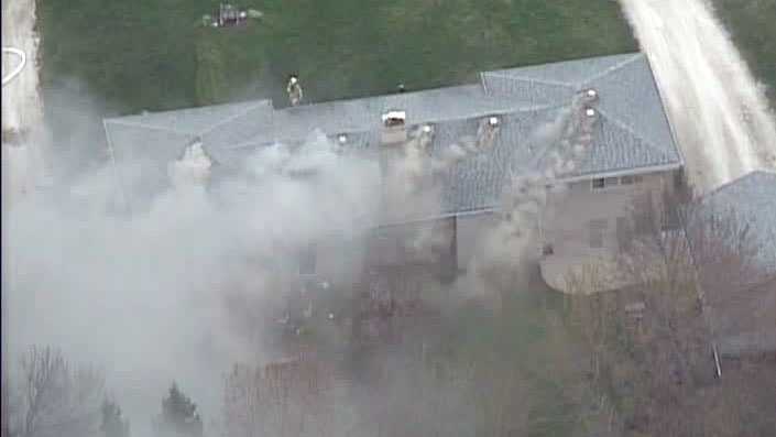 Crews battle Menomonee Falls house fire