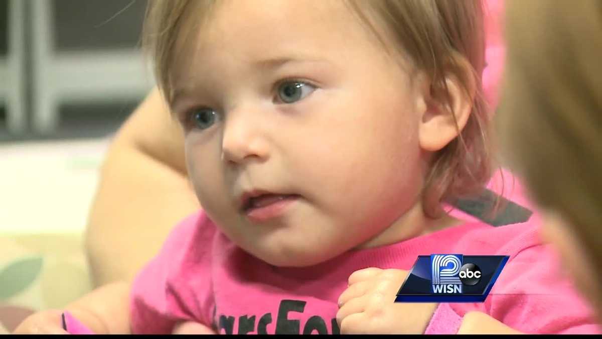 Little girl hears name for first time