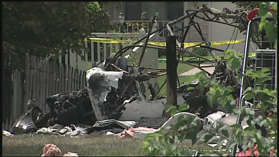 Wreckage remains at a home destroyed by a plane crash in Columbus.