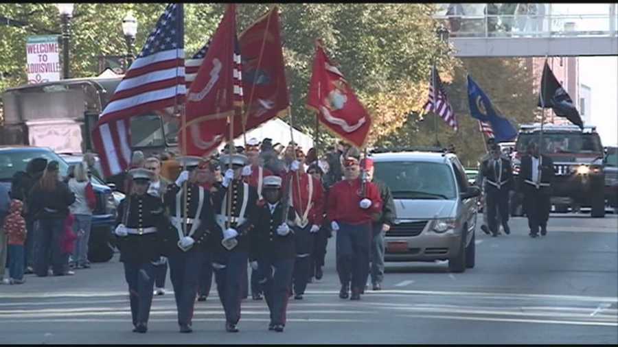 A parade marched through downtown Louisville Monday morning and a wreath was laid in front of Metro Hall in downtown Louisville on Veterans Day.