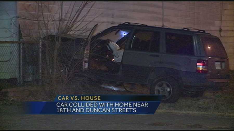 Firefighters said a driver lost control, hit another car, then bounced into a vacant home, as the car burst into flames.