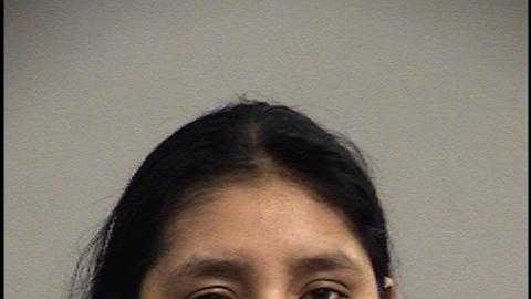 Woman accused of leaving children at home