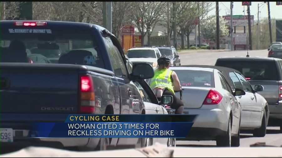 A woman is taking on a local police force after being cited three times for reckless driving on her bike.