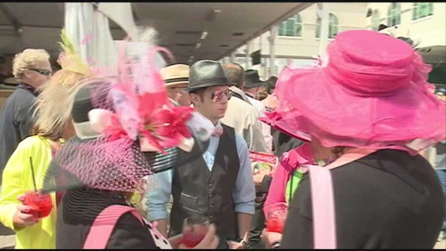 Oaks fans packed Churchill Downs in pink on Oaks Day for breast cancer awareness.