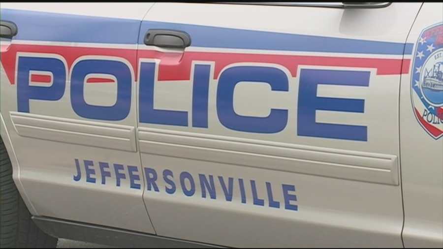 Two Jeffersonville men are arrested after police say they broke into a business while an officer's marked cruiser was outside.