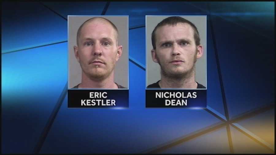 Two men are arrested after police say surveillance video shows them breaking into an area home.
