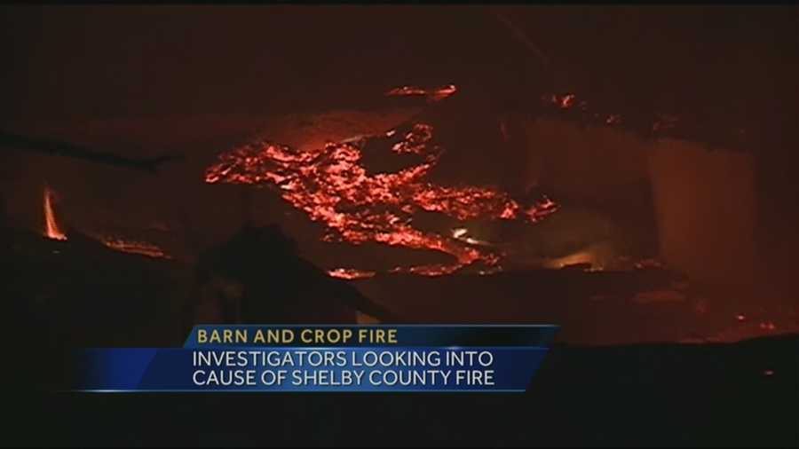 Investigators are looking into what caused a barn and crop fire in Shelby County.