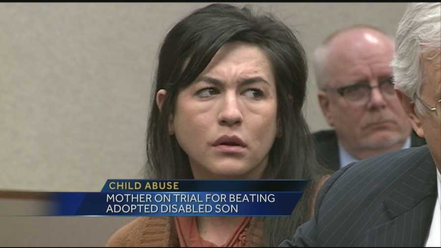 A woman who is accused of beating her adopted disabled son is on trial.