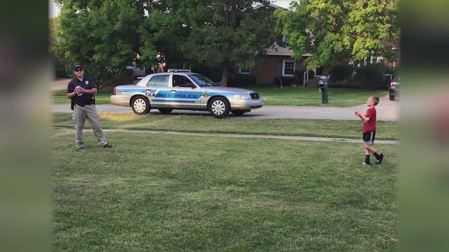 Oldham County police officer plays catch with kid while on patrol