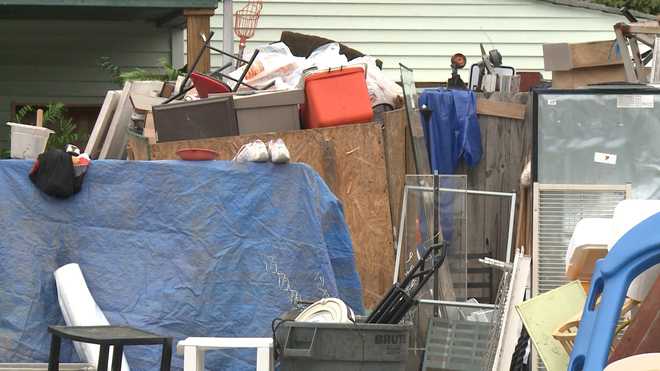 Residents fed up with neighbors junky yard seek action