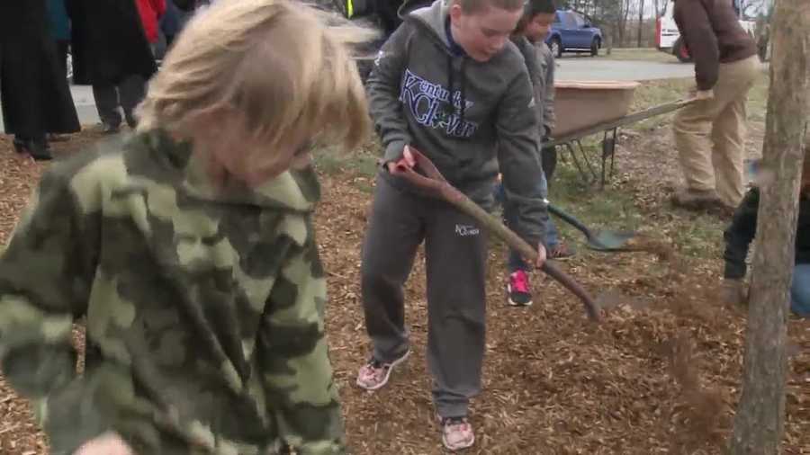 On Friday students helped plant some trees at Medora Elementary School.