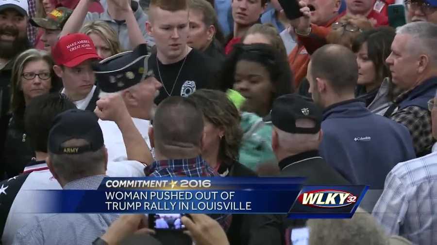Video showing supporters of Republican presidential front-runner Donald Trump pushing a woman out of Tuesday's rally in Louisville has gone viral.