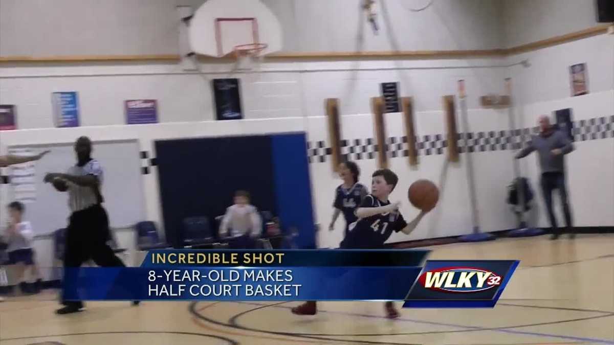 Boy 8 makes half court shot at basketball game Boy 8 makes half court shot at basketball game