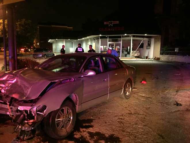 Car crashes into building on Oak Street