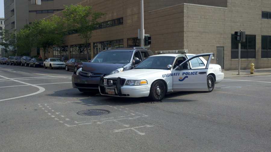 Van, police cruiser collide downtown