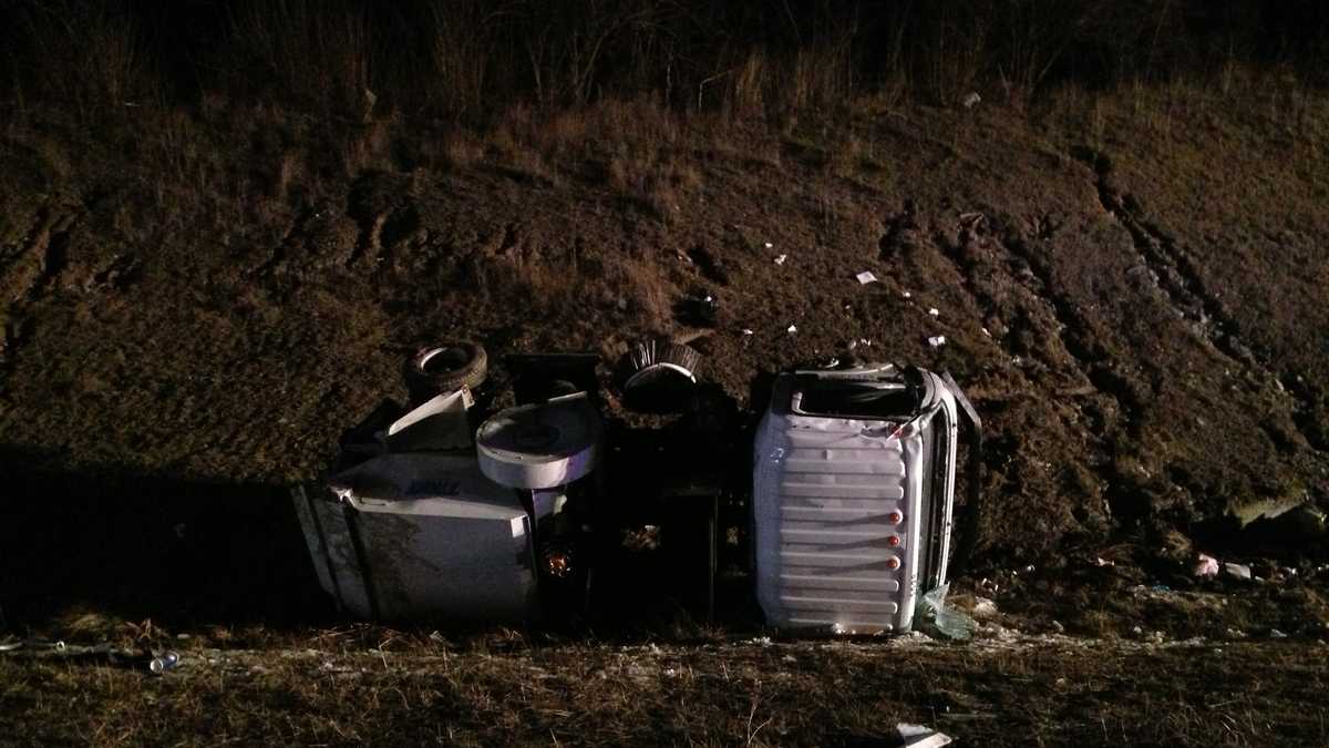 Semi overturns in crash with street sweeper
