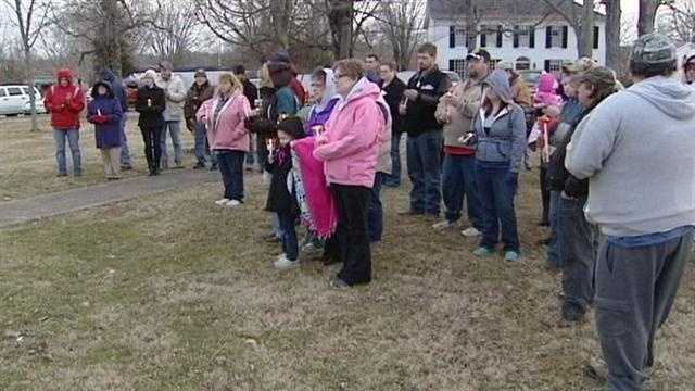 A 9-year-old shooting victims friends and neighbors came out to pray for him tonight in Decatur, Ohio.