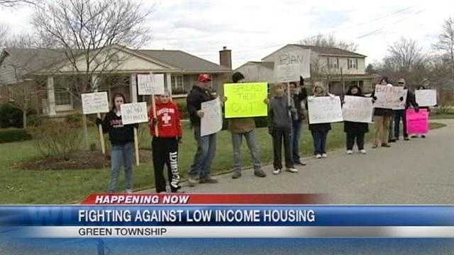 West side residents are protesting again at a Cincinnati Metropolitan Housing Authority board member's home about a housing plan.