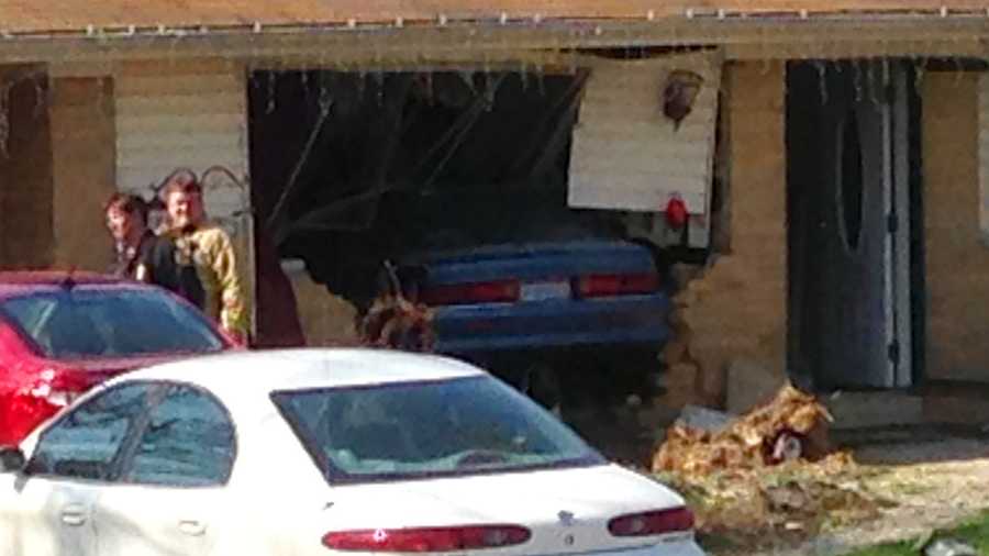 A car drives into the side of a Union Township house.