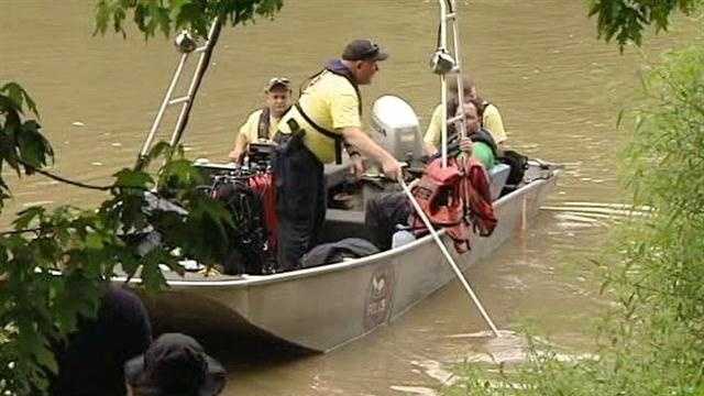 Photos: Authorities search for missing man in river