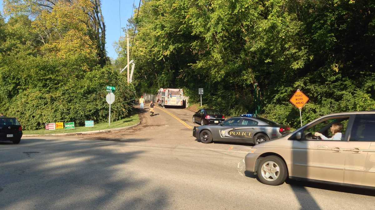 Photos: Dump truck overturns, knocks down power pole