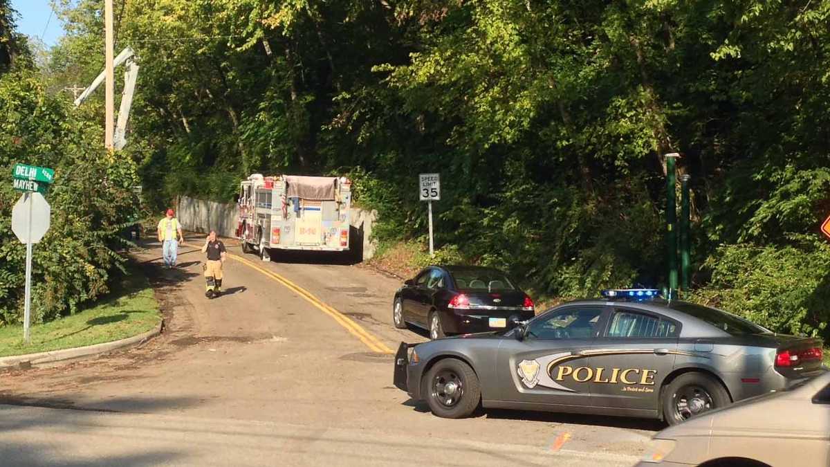 Photos: Dump truck overturns, knocks down power pole