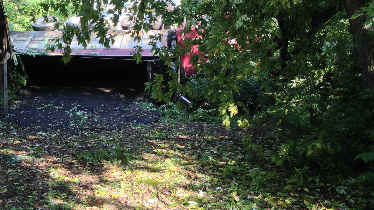 Photos: Dump truck overturns, knocks down power pole