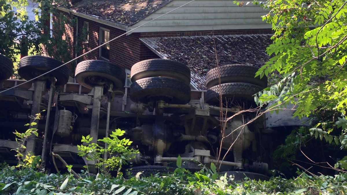 Photos: Dump truck overturns, knocks down power pole