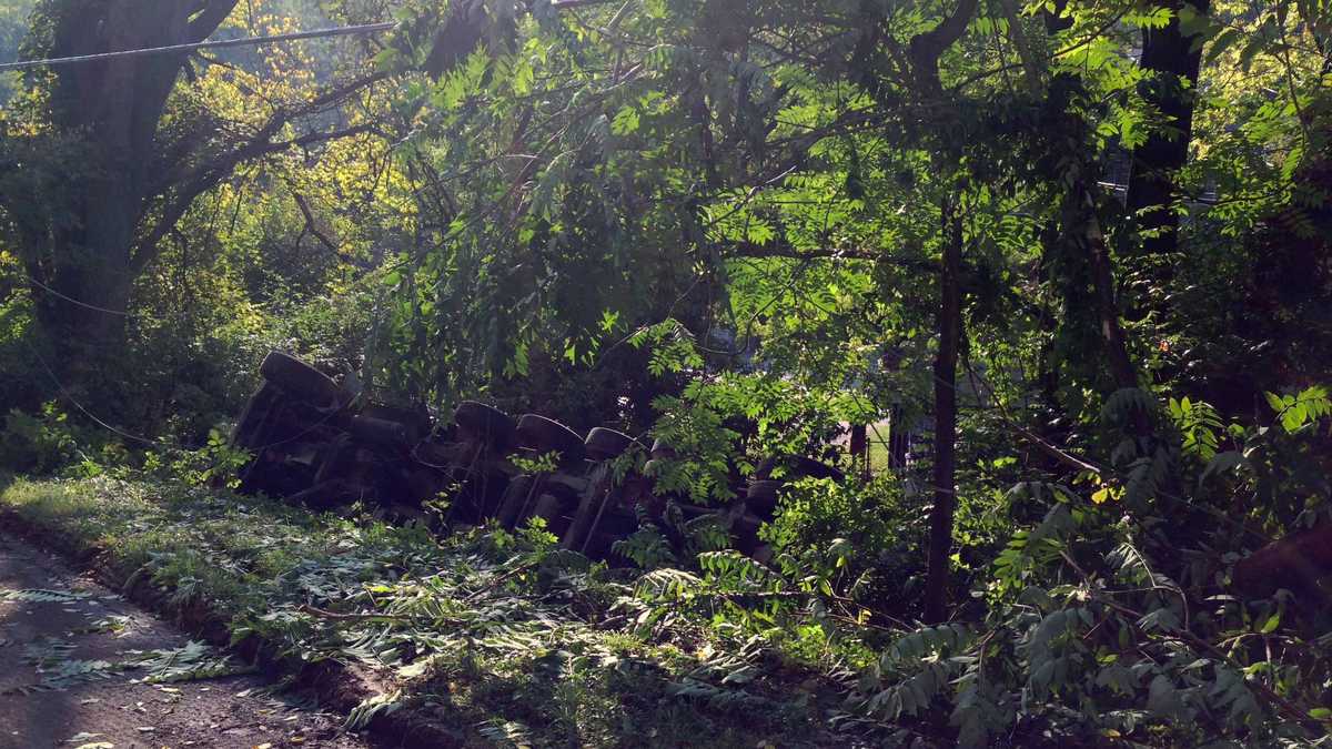 Photos: Dump truck overturns, knocks down power pole