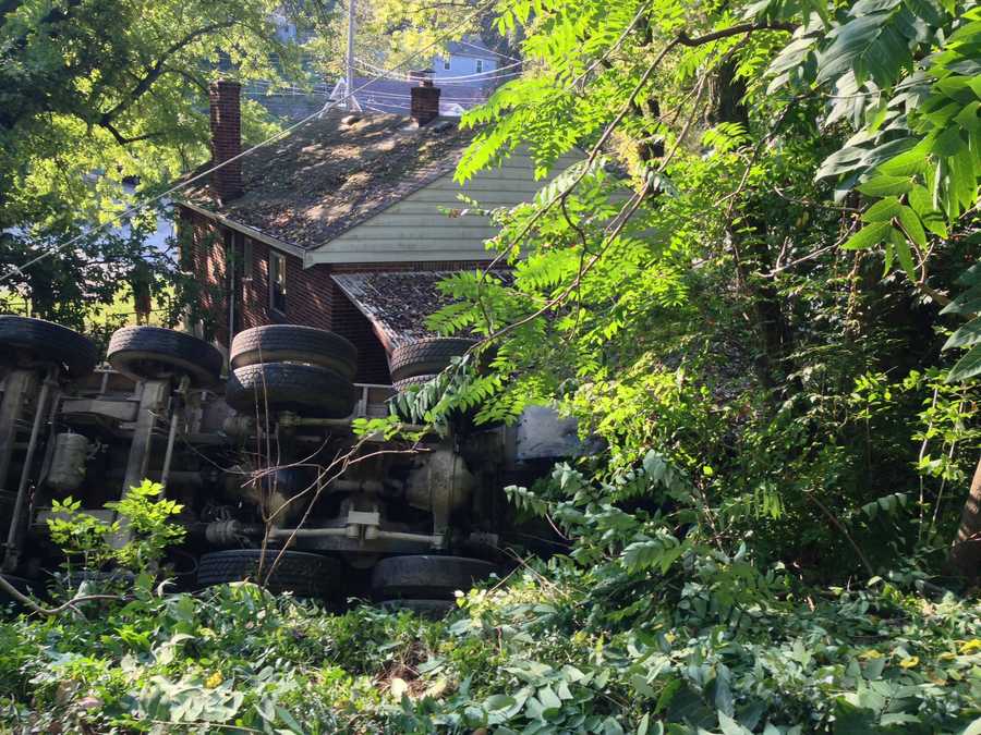 Photos: Dump truck overturns, knocks down power pole