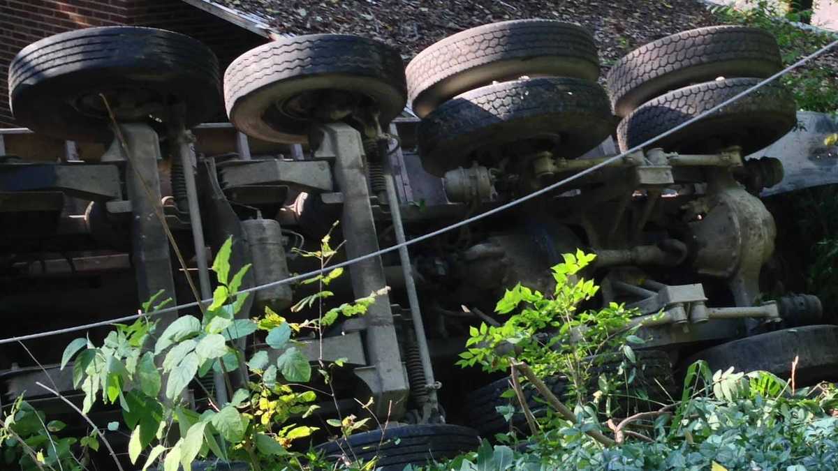 Photos: Dump truck overturns, knocks down power pole