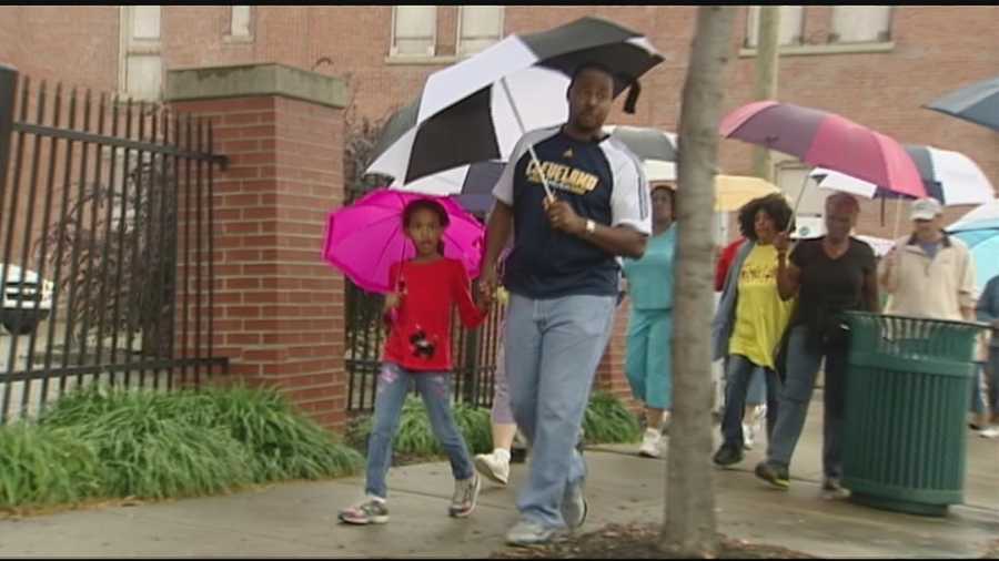 Cincinnati residents joined police officers and church leaders in 14 prayer walks around the city Saturday.