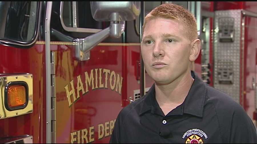 A Hamilton firefighter returning home helped save a man in cardiac arrest at the Jacksonville International Airport.