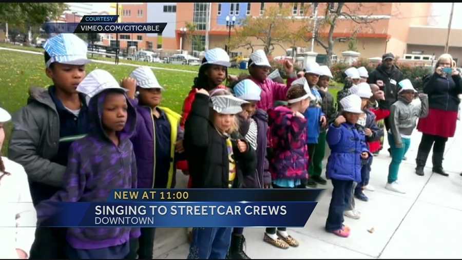 The children are second graders at The School for Creative & Performing Arts and with the help of their teacher, they stopped by the streetcar construction site Thursday and what a great song choice.