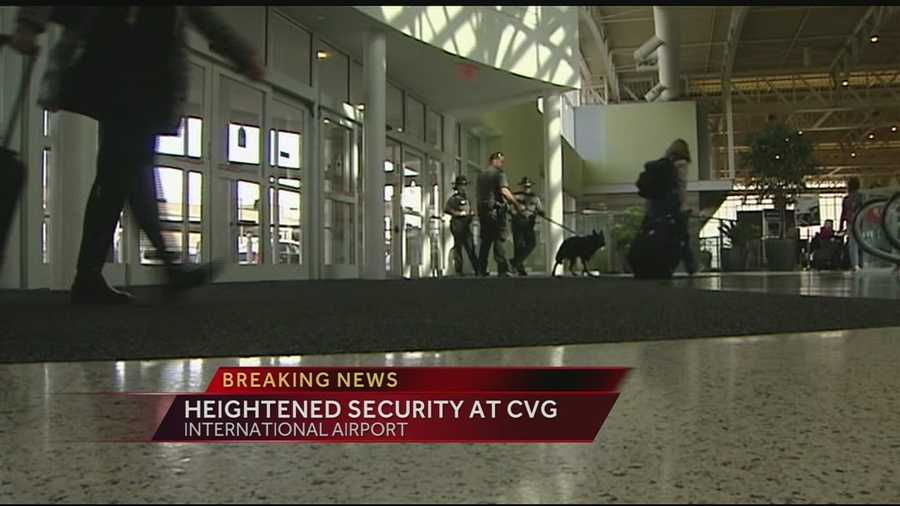 Passengers flying from Cincinnati to Los Angeles noticed heightened security after a TSA officer was shot and killed in the terminal.