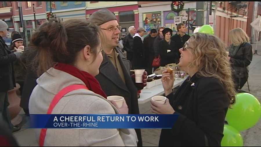 Community and business leaders offered coffee and doughnuts to streetcar construction workers who were back on the job Friday morning.