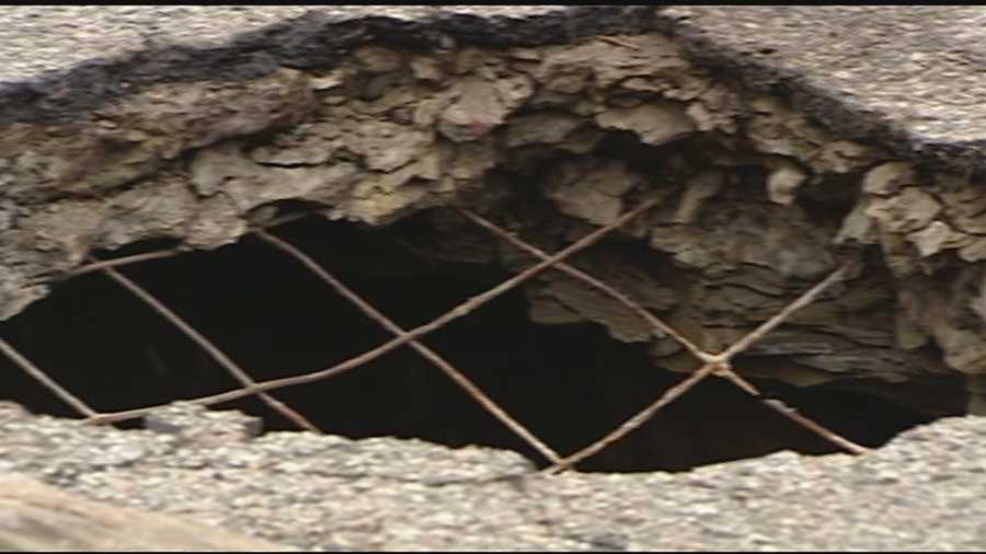 The hole is about as big around as a manhole cover but four or five feet deep.